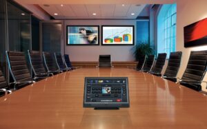 a conference room with a screen on the table